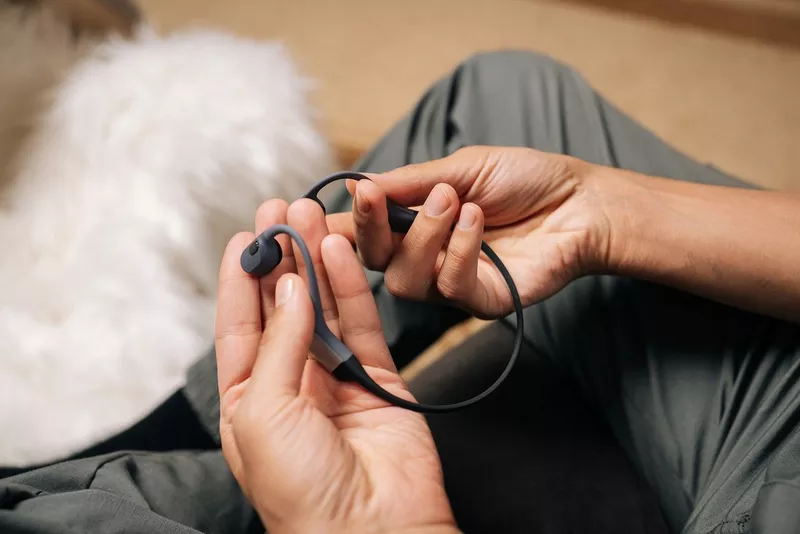 What are open-ear headphones and how do they work?